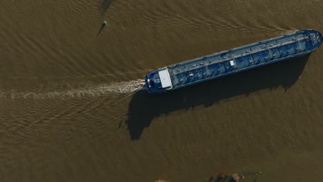 Aerial-birdseye-view-of-a-freighter-on-the-Lek-River-during-flooding-near-the-are-of-Nieuwegein-as-heavy-rains-hit-large-portions-of-Europe