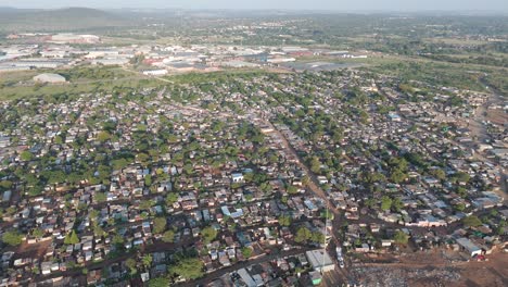 Captivating-aerial-clip,-a-bird's-eye-view-offers-a-sweeping-perspective-over-a-vast-rural-township-outside-Pretoria,-South-Africa