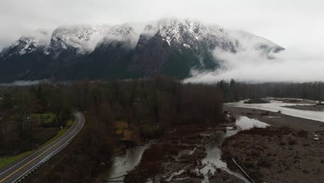 4K-drone-footage-of-snowcapped-Mount-si-in-clouds-and-fog