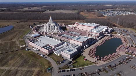 An-aerial-view-of-the-Shri-Swaminarayan-Mandir-in-Robbinsville-Township,-NJ-on-a-sunny-day,-it-was-closed-for-the-day