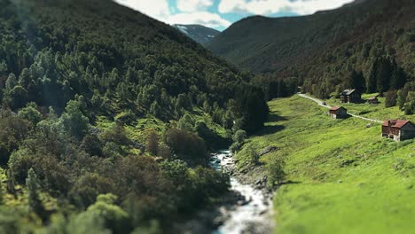 A-river-flows-between-forest-covered-hills-in-the-wide-valley
