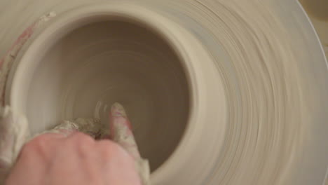 Pottery-artist-making-a-bowl-on-a-throwing-wheel