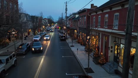 Twilight-over-Lititz,-PA,-with-festive-lights-and-decorations-lining-the-historic-main-street,-creating-a-cozy-holiday-ambiance
