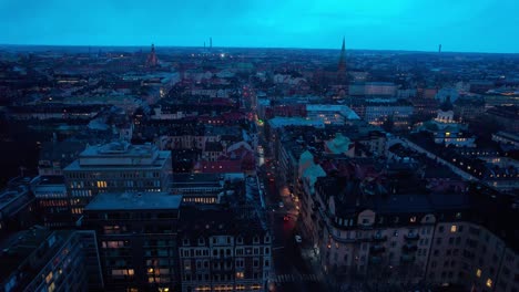 Aerial-Drone-View-Stockholm-by-Evening-with-Cars-Driving-on-the-Streets,-Skyline-of-Stockholm-from-the-Sky