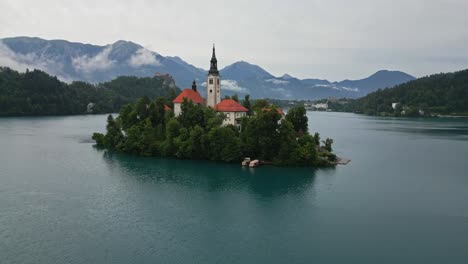 Upward-drone-shot-of-Lake-Bled,-Slovenia-in-the-morning-during-summer-time