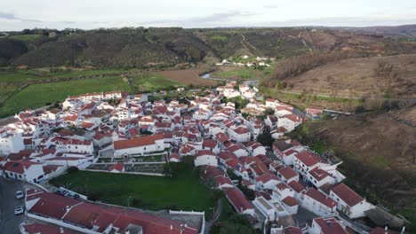 Odeceixe-village-aerial-view,-Portugal's-serene-coast---Aerial-flyover