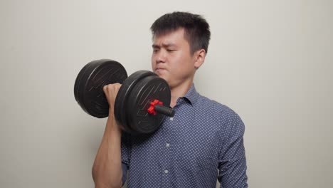 Middle-Shot-Asian-Office-Worker,-Man-Lifting-Dumbbell-Gymnastics-in-office-clothes