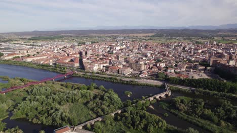 Talavera-de-la-Reina's-cityscape,-riverside-view,-Spain---aerial