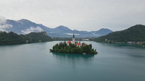 Orbit-drone-shot-of-Lake-Bled,-Slovenia-in-the-morning-during-summer-time