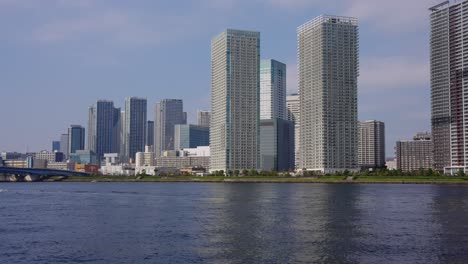 Tokyo-Bay-Area,-Establishing-Shot-of-Skyscrapers-from-Toyosugururi-Park-4k