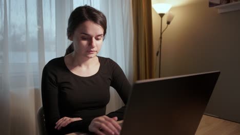 Girl-Browsing-Internet-On-Laptop---Close-Up