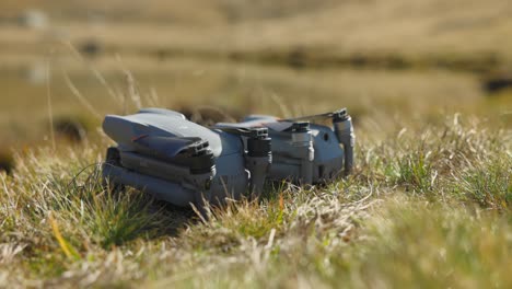 Folded-DJI-Air-2S-And-Air-3-On-Grass-For-Side-By-Side-Comparison