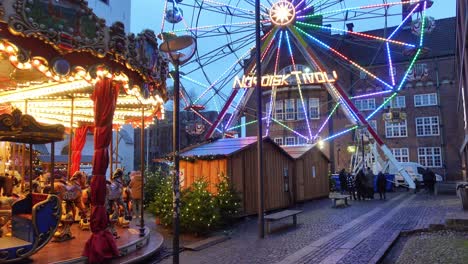 Ferris-wheel-and-kids-carousel-at-a-Christmas-market