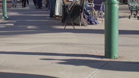 Tourists-shopping-from-street-vendors-in-downtown-Santa-Fe,-New-Mexico-with-stable-video-shot-tilting-up