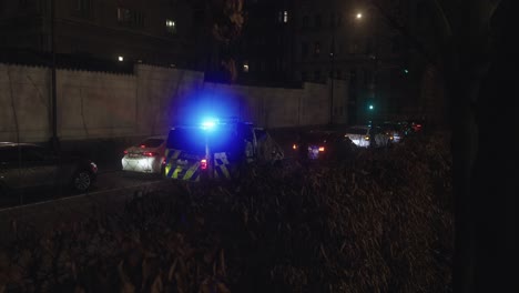 Flashing-beacons-of-a-police-car-at-an-evening-accident-in-the-middle-of-the-city
