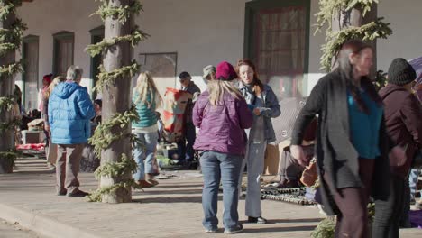 Tourists-shopping-from-street-vendors-in-downtown-Santa-Fe,-New-Mexico-with-stable-video