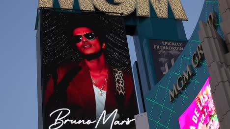 Looking-Up-At-Illuminated-MGM-Casino-Logo-With-Advert-For-Bruno-Mars-Show