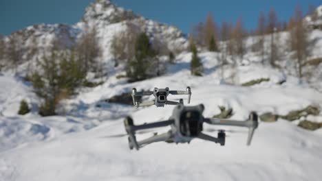 DJI-Air-3-Hovering-In-Front-Of-Air-2S-With-Bokeh-Snow-White-Background