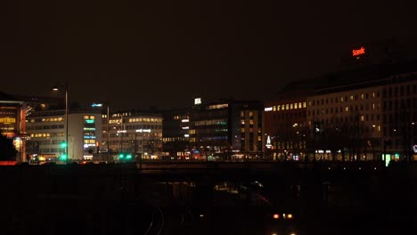 Train-going-through-the-city-center-at-night