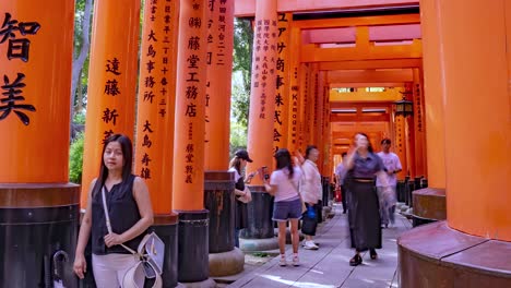 Time-lapse-of-people-Tourists-walking-through-the-Famous-Fushimi-Inari-Torii-Gates-Shrine,-Kyoto,-Japan-View-1