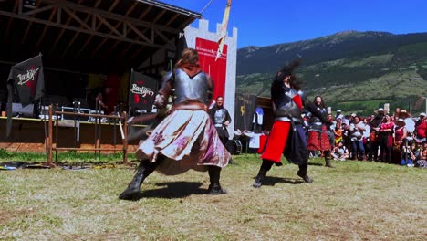 fighting-scene-performed-by-Burdyri,-a-professional-sword-and-stage-combat-team,-during-the-South-Tyrolean-Medieval-Games-2023,-hand-held