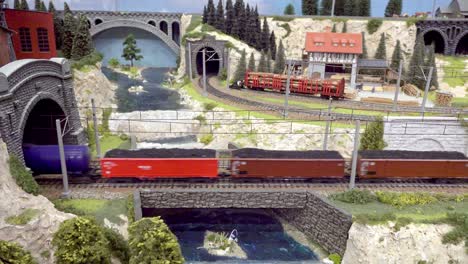 Part-of-the-model-train-layout-at-the-25th-exhibition-of-model-trains-in-motion-in-Kaltern,-South-Tyrol,-Italy---Freight-train