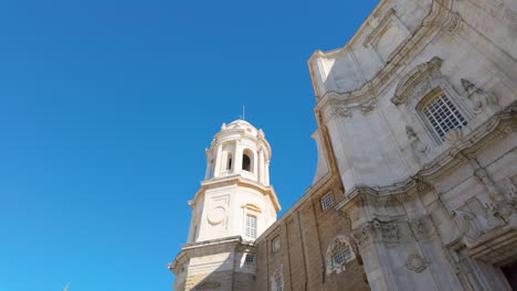 Bell-tower-of-a-baroque-church-against-the-clear-sky-in-Cádiz