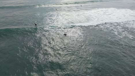 aerial-view-of-Foil-Surfer-Surfing-Ocean-Waves-Slow-Motion