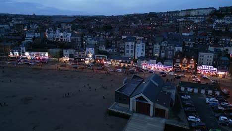 Aerial-drone-forward-moving-shot-over-beachside-houses-in-the-town-of-Scarborough,-North-Yorkshire,-England-during-evening-time