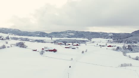Above-View-Of-Snow-Covered-Houses-During-Winter-Stormy-Day