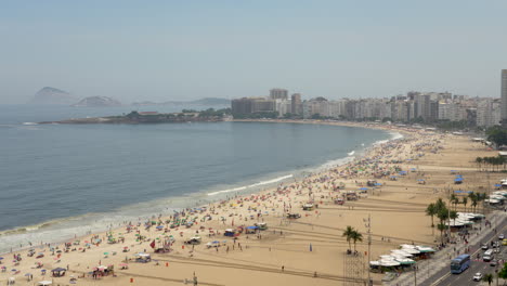 Famous-Copacabana-beach-next-to-boulevard-in-Rio-de-Janeiro,-Brazil