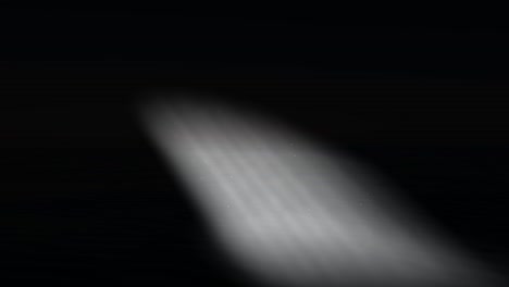 Simulation-of-ground-spotlight-on-black-background-with-particles-fluctuating