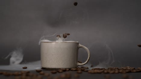 Coffee-bean-falling-into-a-mug-filled-with-smoke-in-super-slow-motion