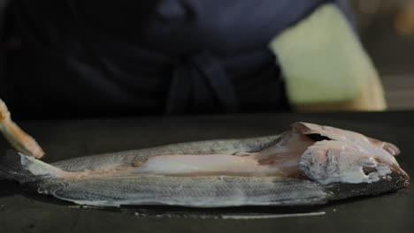 Brushing-aioli-onto-a-whole-fish-in-slow-motion