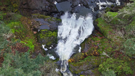 4K-drone-footage-flying-over-waterfall-in-forest