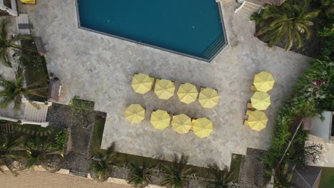 Aerial-top-down-shot-of-allezboo-resort-in-golden-morning-light-featuring-beach-and-swimming-pool
