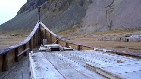 Inside-old-wooden-boat-stranded-in-coastal-region,-Iceland