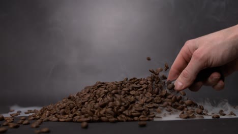 scooping-coffee-beans-with-smoke-everywhere-in-super-slow-motion