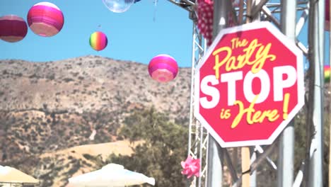 Sign-saying-Party-Stop-with-Festival-Decoration-on-Background