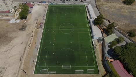 Aerial-view-of-team-training-on-football-field