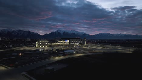 Primary-Children's-Hospital-in-Lehi,-Utah---aerial-approach-before-dawn