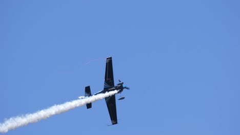 Aerobatic-Propeller-Airplane-Flying-Airshow-with-Trailing-Smoke-SLOMO