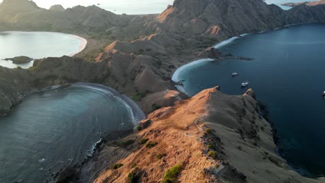 Drone-video-over-dry-barren-island-with-protected-bays-during-sunset