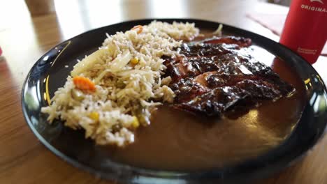 Plate-full-of-rice-and-slow-cooked-beef-ribs