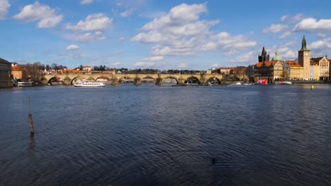 Charles-Bridge-over-Vltava-river-and-Old-Town-Bridge-Tower-viewed-from-Shooters-Island,-Prague,-Czech-Republic