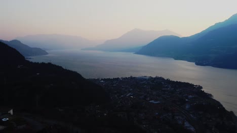 City-of-Mandello-Lario-near-lake-Como-in-Italy,-aerial-sunrise-view