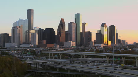 Establishing-aerial-shot-of-downtown-Houston,-Texas-during-sunset