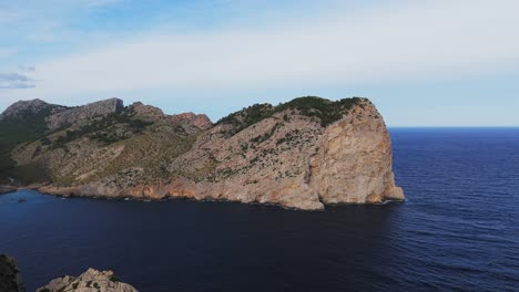 Aerial-View,-Rocky-Cliffs-By-The-Mediterranean-Coastline-Of-Majorca,-Spain