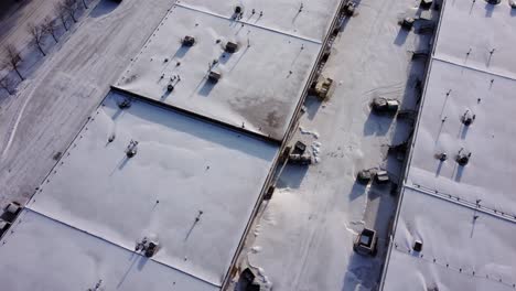 Offices-and-warehouses-covered-with-snow,-viewed-from-above