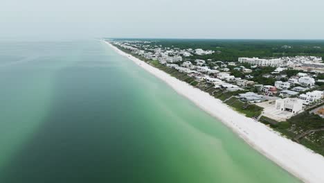 Rosmery-Beach-FL-side-ways-view,-ocean,-sand,-houses-with